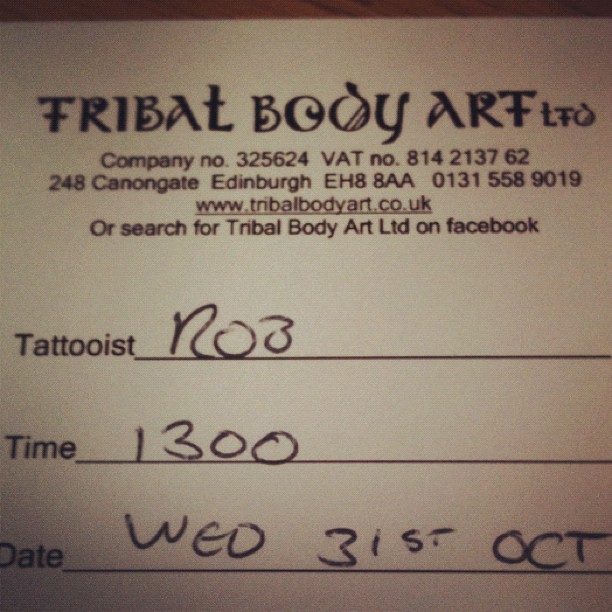 Tattoo appointment form from Tribal Body Art Ltd with handwritten details: tattooist Rob, time 1300, date Wed 31st Oct.