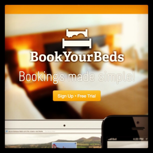 BookYourBeds logo and text “Bookings made simple!” over a blurred bed background, with a “Sign Up - Free Trial” button and phone screen.