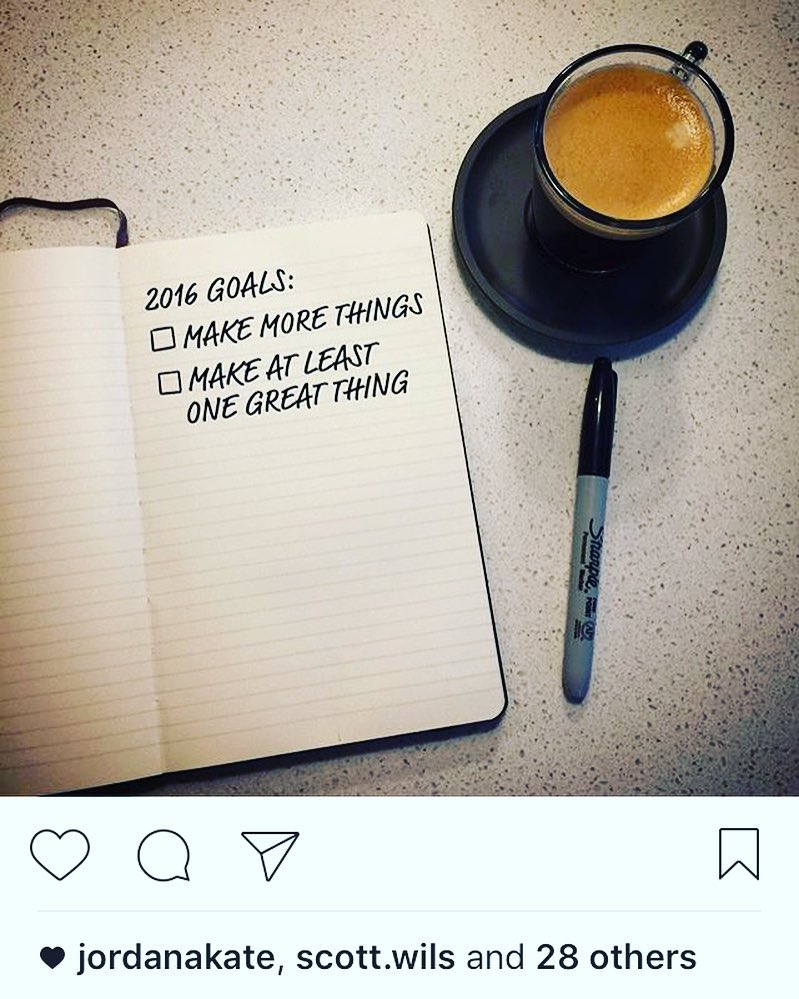 Open notebook with handwritten 2016 goals beside a cup of coffee and a marker on a speckled countertop, shown in an Instagram post.