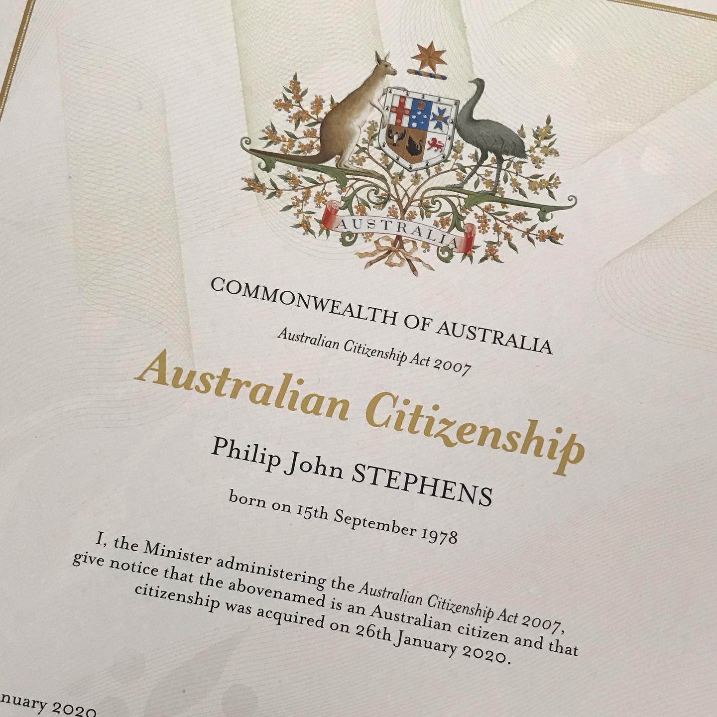 Australian citizenship certificate with coat of arms at top and the name Philip John Stephens on the page.
