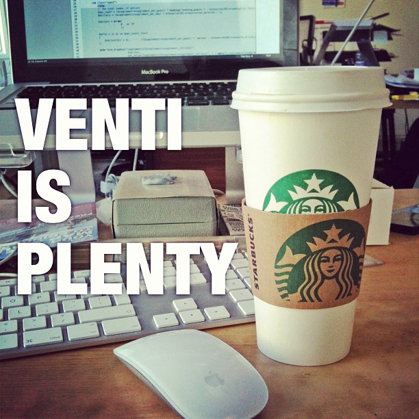 Starbucks cup on a desk with a keyboard, mouse, laptop, and large text reading "VENTI IS PLENTY