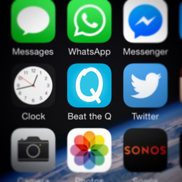 Close-up of smartphone app icons including Messages, WhatsApp, Messenger, Clock, Beat the Q, Twitter, Camera, Photos, and Sonos.
