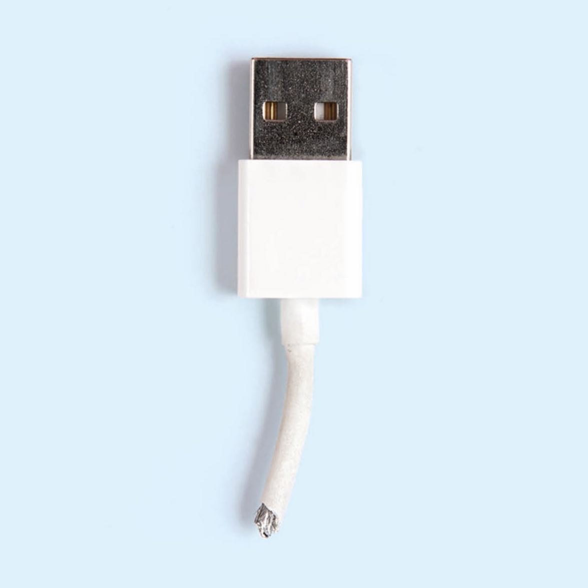 White USB cable with a frayed, broken end on a light blue background.