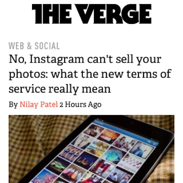 Screenshot of a Verge article headline about Instagram terms of service above a tablet displaying a grid of photos.