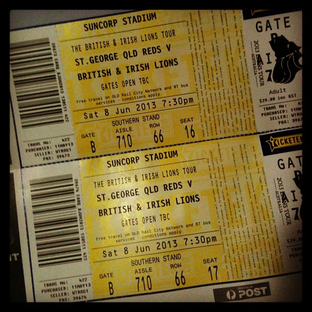 Two yellow Suncorp Stadium tickets for St. George QLD Reds vs British & Irish Lions, dated Sat 8 Jun 2013, seats 16 and 17.