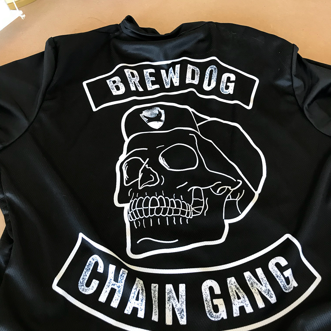 Black shirt with a white skull in a cap and the words “BREWDOG” above and “CHAIN GANG” below.